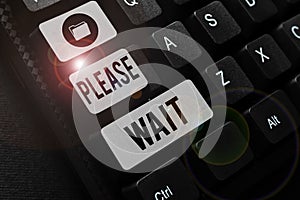 Text sign showing Please Wait. Business concept to pause any implemented action immediately and hold on Typing Daily