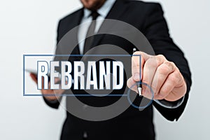 Text showing inspiration Rebrand. Concept meaning Change corporate image of company organization Marketing strategy