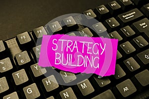 Text showing inspiration Strategy Building. Business concept Leveraging Buying and acquiring others platforms Typing