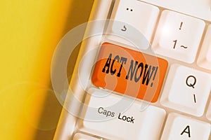 Text sign showing Act Now. Conceptual photo do not hesitate and start working or doing stuff right away White pc keyboard with