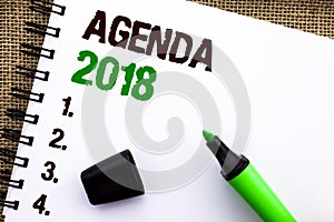 Text sign showing Agenda 2018. Conceptual photo Strategy Planning Things Schedule Future Goals Organize written on Notebook Book o