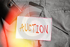Text sign showing Auction. Conceptual photo Public sale Goods or Property sold to highest bidder Purchase Smartphone device inside