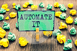 Text sign showing Automate It. Conceptual photo convert process or facility to be operated automatic equipment. Clothespin holding