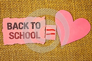 Text sign showing Back To School. Conceptual photo Return to class first day of studies Classroom Arriving Text pink torn note equ