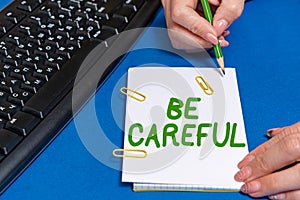 Text sign showing Be Careful. Business concept making sure of avoiding potential danger mishap or harm Hands pointing