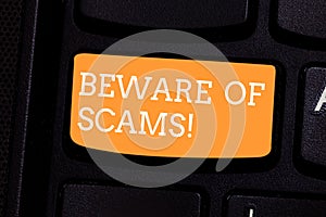 Text sign showing Beware Of Scams. Conceptual photo Stay alert to avoid fraud caution be always safe security Keyboard