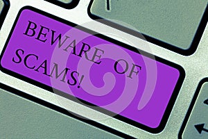 Text sign showing Beware Of Scams. Conceptual photo Stay alert to avoid fraud caution be always safe security Keyboard