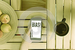 Text sign showing Bias. Conceptual photo inclination or prejudice for or against one demonstrating group