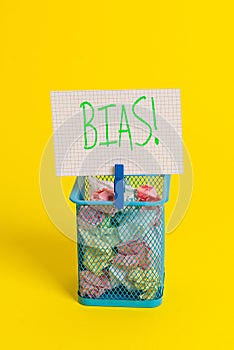 Text sign showing Bias. Conceptual photo inclination or prejudice for or against one demonstrating group Trash bin