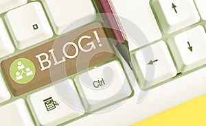 Text sign showing Blog. Conceptual photo regularly updated website web page run by individual or group White pc keyboard
