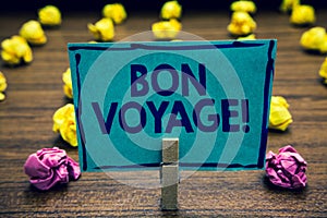 Text sign showing Bon Voyage. Conceptual photo used express good wishes to someone about set off on journey Clothespin holding blu