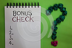 Text sign showing Bonus Check. Conceptual photo something in addition to what is expected or strictly due Open notebook crumpled p