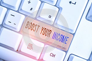 Text sign showing Boost Your Income. Conceptual photo Increase your money Investment Freelancing Trading White pc