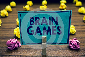 Text sign showing Brain Games. Conceptual photo psychological tactic to manipulate or intimidate with opponent Clothespin holding