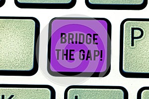 Text sign showing Bridge The Gap. Conceptual photo Overcome the obstacles Challenge Courage Empowerment Keyboard key