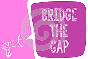 Text sign showing Bridge The Gap. Conceptual photo Overcome the obstacles Challenge Courage Empowerment Megaphone loudspeaker spee