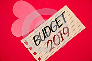 Text sign showing Budget 2019. Conceptual photos New year estimate of incomes and expenses Financial PlanNotebook page red backgro