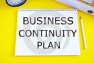 Text sign showing Business Continuity Plan. Conceptual photo creating systems prevention deal potential threats. Yellow background