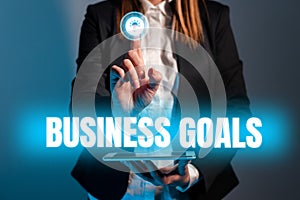 Text sign showing Business Goals. Business showcase Marketing Methodologies Processes and Technologies use Businesswoman