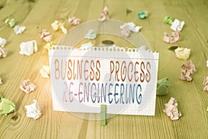Text sign showing Business Process Re Engineering. Conceptual photo the analysis and design of workflows Colored crumpled papers