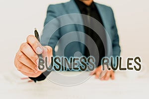 Text sign showing Business Rules. Business concept a specific directive that constrains or defines a business Discussing