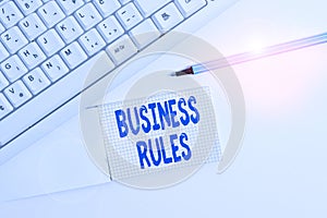 Text sign showing Business Rules. Conceptual photo a specific directive that constrains or defines a business White pc keyboard