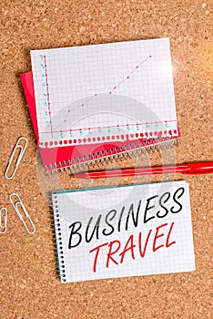 Text sign showing Business Travel. Conceptual photo travel on behalf of a company to one or more destinations Desk notebook paper