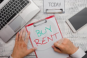 Text sign showing Buy Rent. Conceptual photo choosing between purchasing something or paying for usage.