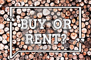 Text sign showing Buy Or Rent. Conceptual photo Doubt between owning something get it for rented Indecision Wooden background