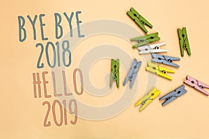 Text sign showing Bye Bye 2018 Hello 2019. Conceptual photo Starting new year Motivational message 2018 is over Yellow base with p