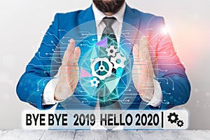 Text sign showing Bye Bye 2019 Hello 2020. Conceptual photo Starting new year Motivational message 2019 is over Male