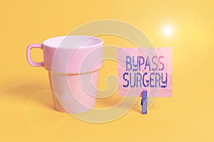 Text sign showing Bypass Surgery. Conceptual photo type of surgery that improves blood flow to the heart Cup empty paper blue