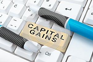 Text sign showing Capital Gains. Concept meaning Bonds Shares Stocks Profit Income Tax Investment Funds