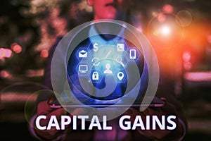 Text sign showing Capital Gains. Conceptual photo Bonds Shares Stocks Profit Income Tax Investment Funds.