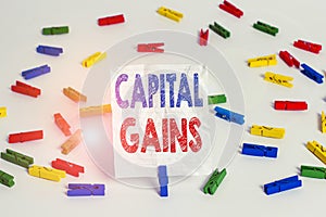 Text sign showing Capital Gains. Conceptual photo Bonds Shares Stocks Profit Income Tax Investment Funds Colored