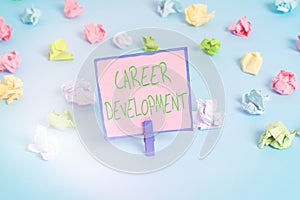 Text sign showing Career Development. Conceptual photo Lifelong learning Improving skills to get a better job Colored crumpled