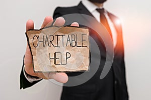 Text sign showing Charitable Help. Conceptual photo system of giving money or help free to those who are in need Male human wear
