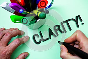 Text sign showing Clarity. Conceptual photo Certainty Precision Purity Comprehensibility Transparency Accuracy Man holding black m photo