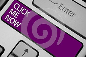Text sign showing Click Me Now. Conceptual photo Internet helping desk Press the button Online Icon Nertwork Keyboard purple key I