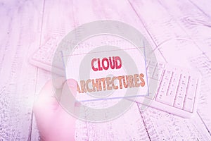 Text sign showing Cloud Architectures. Conceptual photo Various Engineered Databases Softwares Applications man holding colorful