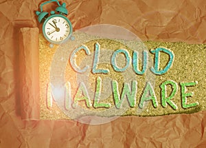 Text sign showing Cloud Malware. Conceptual photo malicious software file or program harmful to a computer Alarm clock and torn
