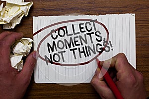 Text sign showing Collect Moments, Not Things. Conceptual photo Happiness philosophy enjoy simple life facts Hand hold paper lob a