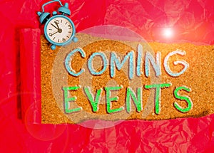 Text sign showing Coming Events. Conceptual photo happening or appearing soon Upcoming Forthcoming event Alarm clock and torn