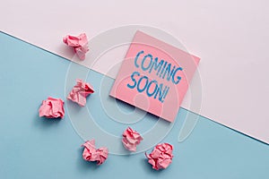 Text sign showing Coming Soon. Conceptual photo event or action that will happen after really short time Note papers and