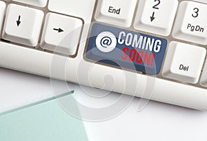 Text sign showing Coming Soon. Conceptual photo event or action that will happen after really short time White pc keyboard with