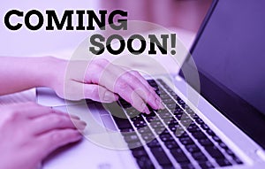 Text sign showing Coming Soon. Conceptual photo event or action that will happen after really short time woman laptop