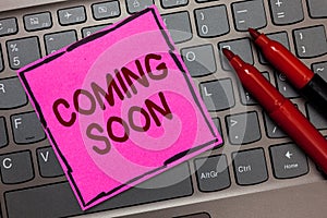 Text sign showing Coming Soon. Conceptual photo something is going to happen in really short time of period Pink paper keyboard In