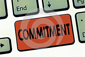 Text sign showing Commitment. Conceptual photo Quality of being dedicated to cause activity Engagement