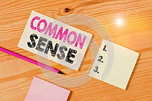 Text sign showing Common Sense. Conceptual photo having good sense and sound judgment in practical matters Colored clothespin