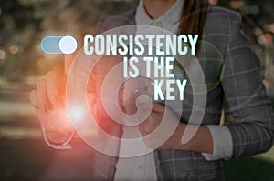 Text sign showing Consistency Is The Key. Conceptual photo full Dedication to a Task a habit forming process Woman wear photo